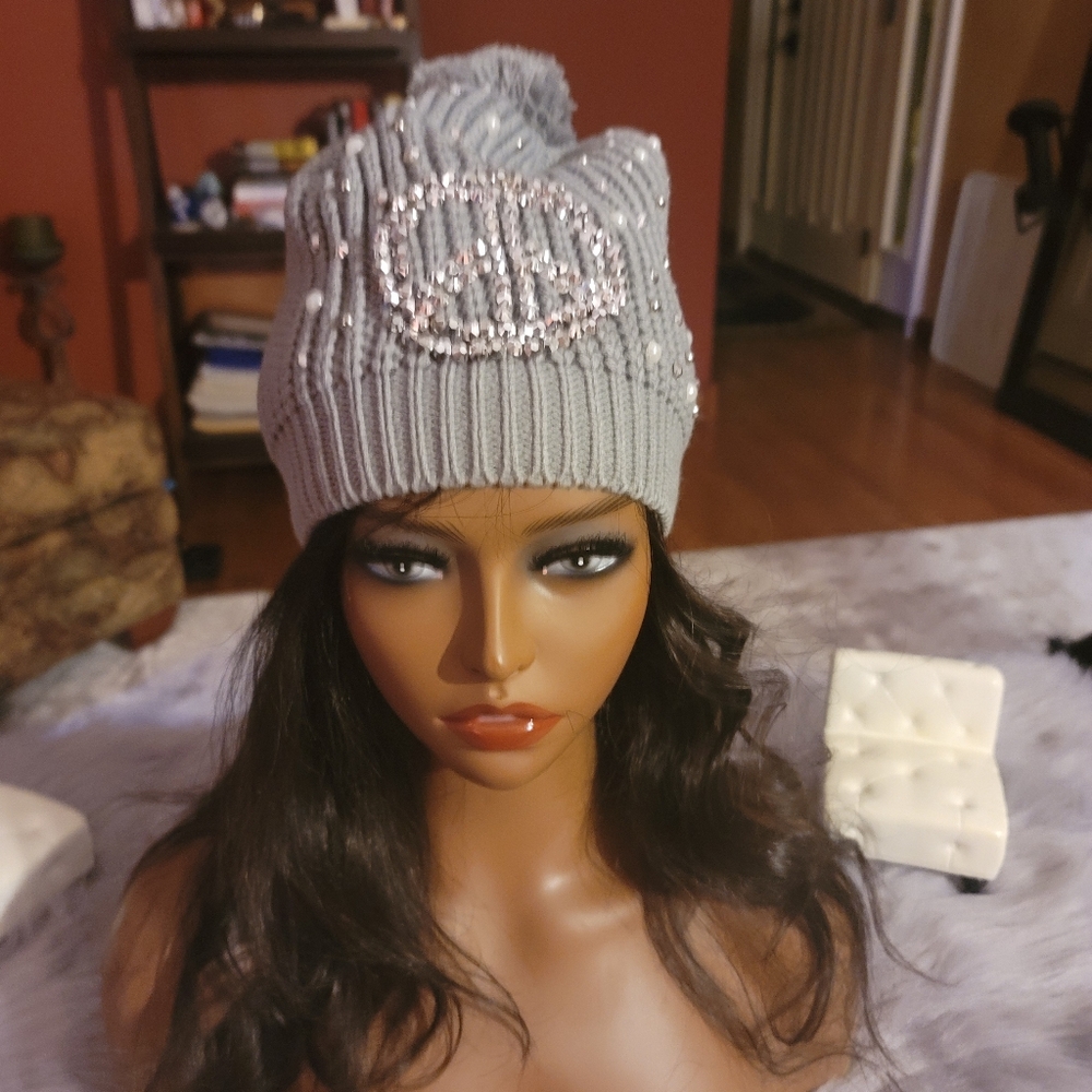 Hat with silver peace sign embellishment